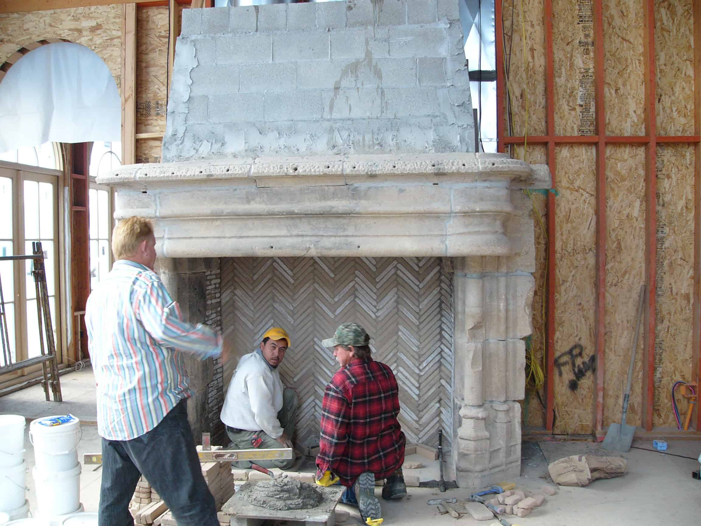 Stone Fireplace with Clay Tile Fireback Under Construction